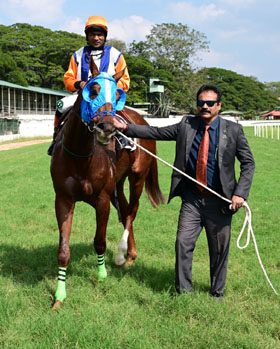 Great Hope (A Imran Khan up), winner of the Kinski Plate, being led in by trainer Monnappa C D on Wednesday races at Mysore.